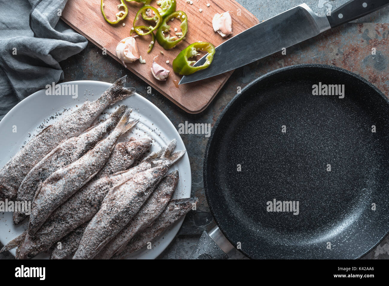 Chili and garlic, smelt on a plate and frying pan horizontal Stock Photo