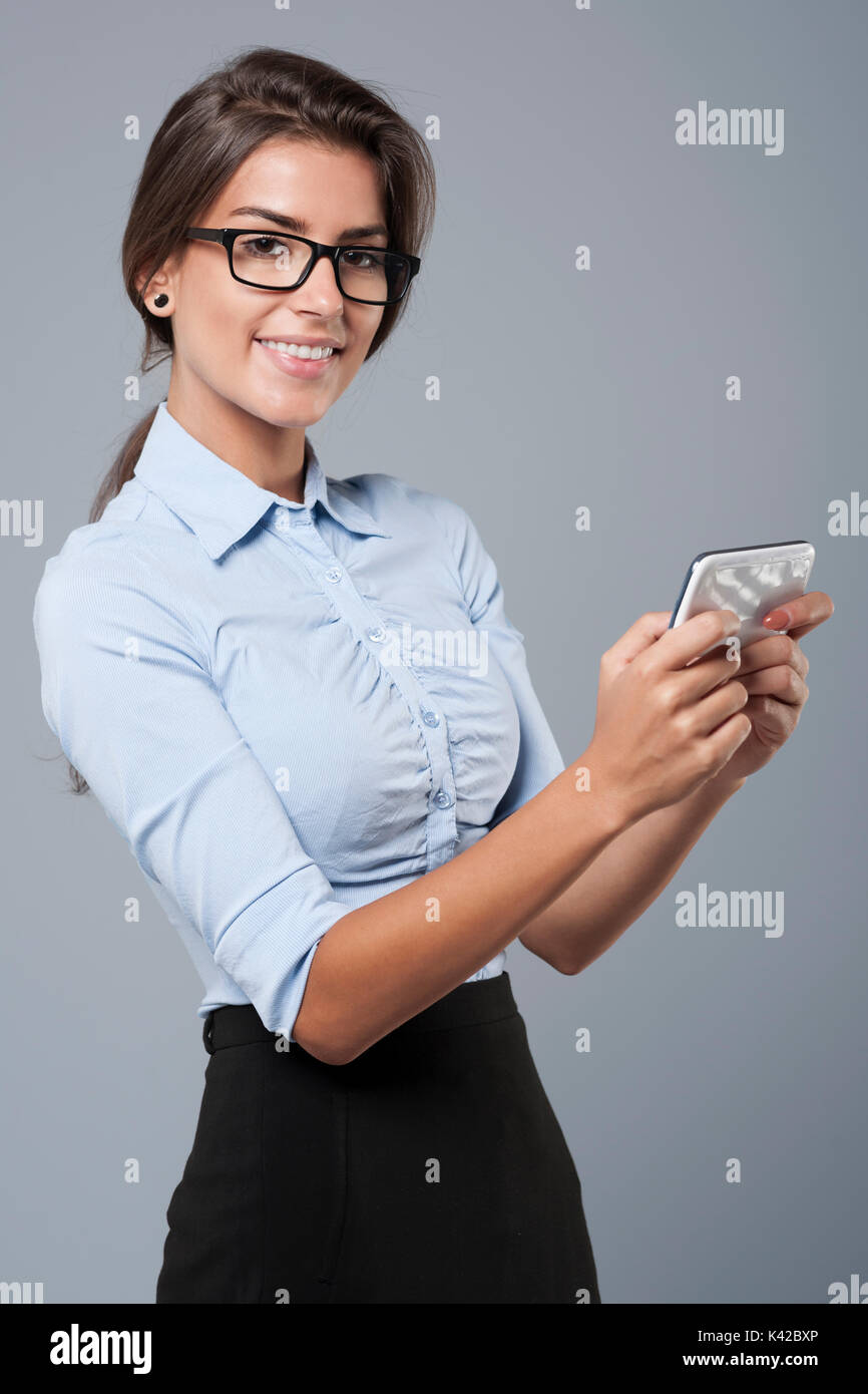 Woman checking smartphone in candid hi-res stock photography and images ...