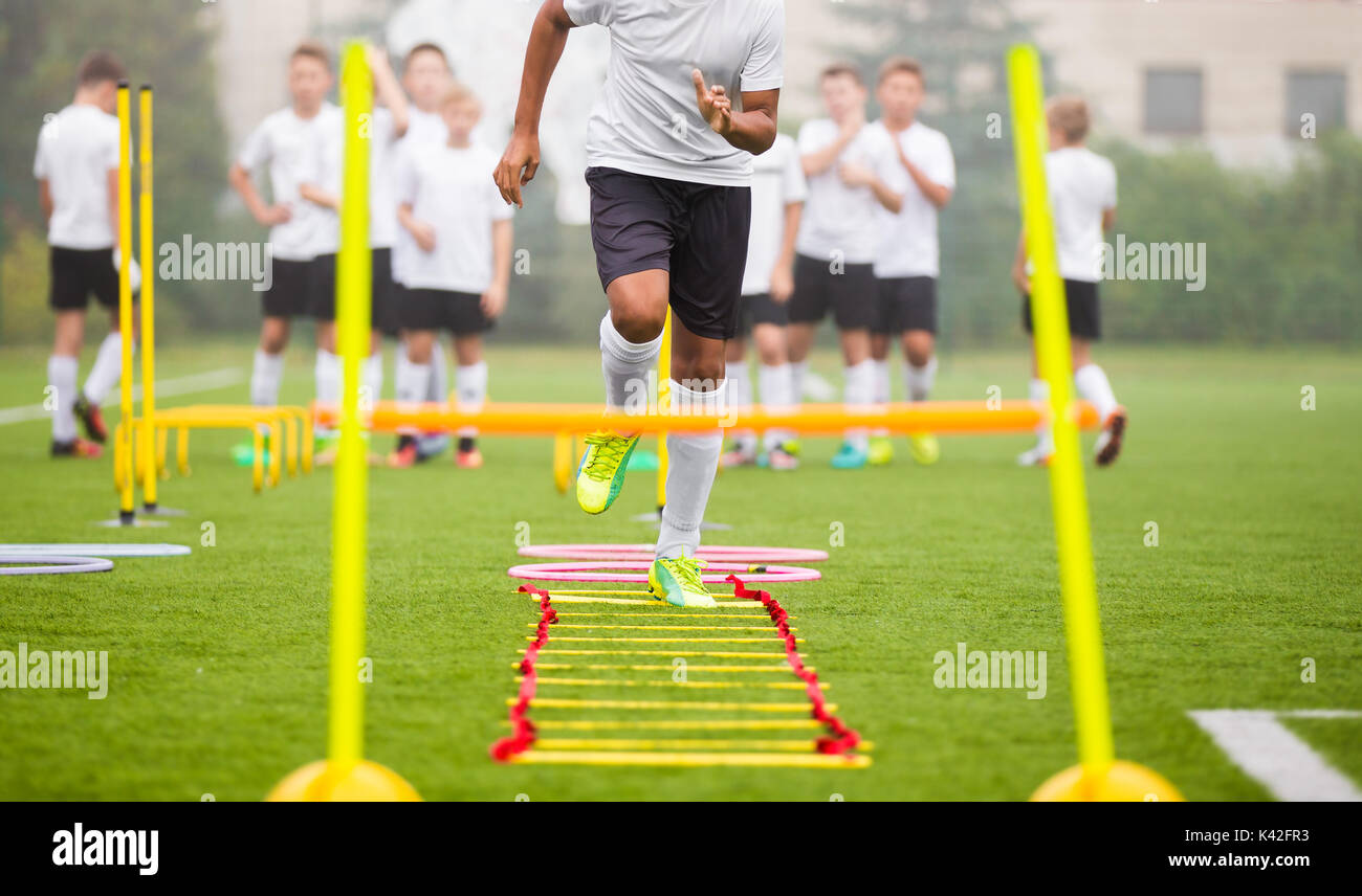 Boy Soccer Player In Training. Young Soccer Players at Practice Session Stock Photo