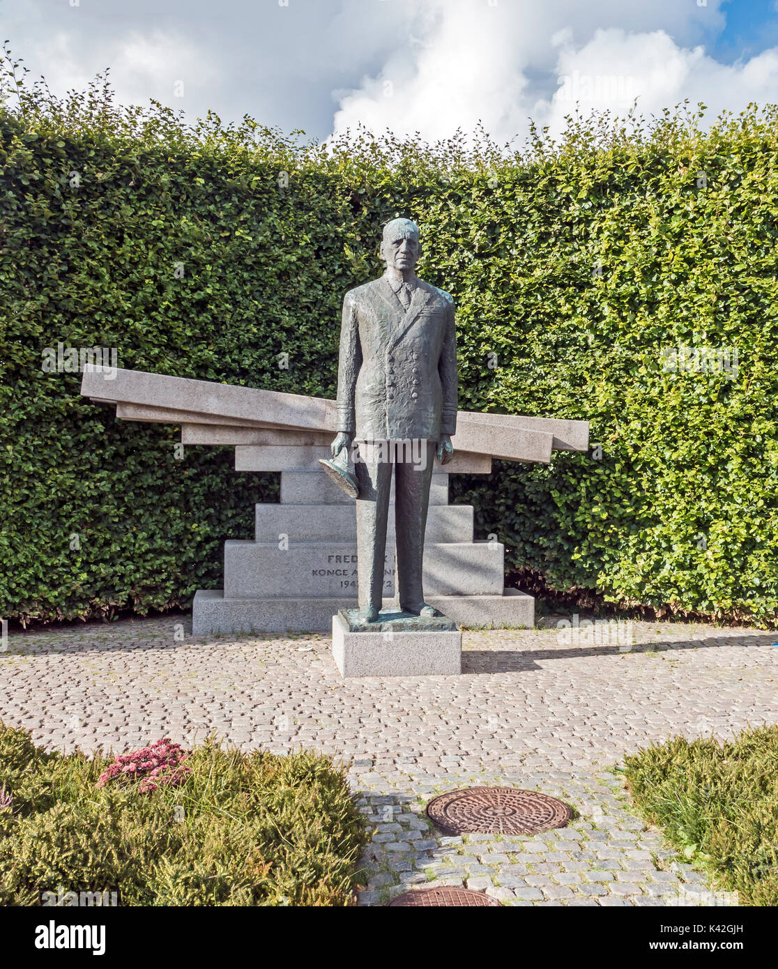 Bronze statue of Danish king Frederik IX with granite monument at Nordre Toldbod in Copenhagen Denmark Europe Stock Photo