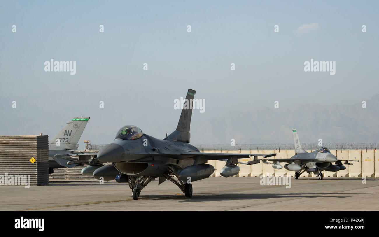 F-16 Fighting Falcons taxi on the flightline. Stock Photo