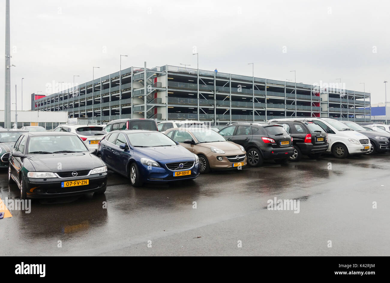 Parking, full car park, building at  Eindoven Airport. Eindhoven, North Brabant, Netherlands. Stock Photo