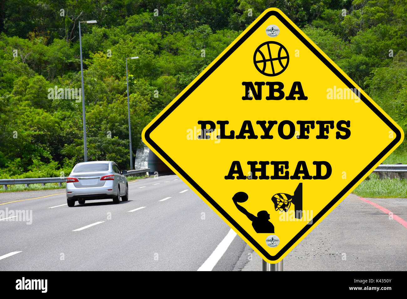 NBA playoffs ahead, yellow warning street sign Stock Photo