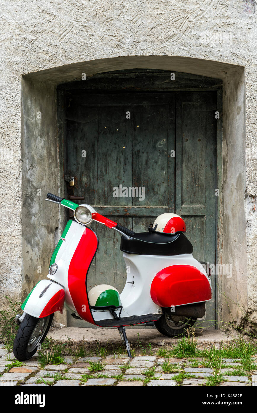 Parked Vespa scooter painted in Italian flag colors, Rome, Lazio, Italy Stock Photo