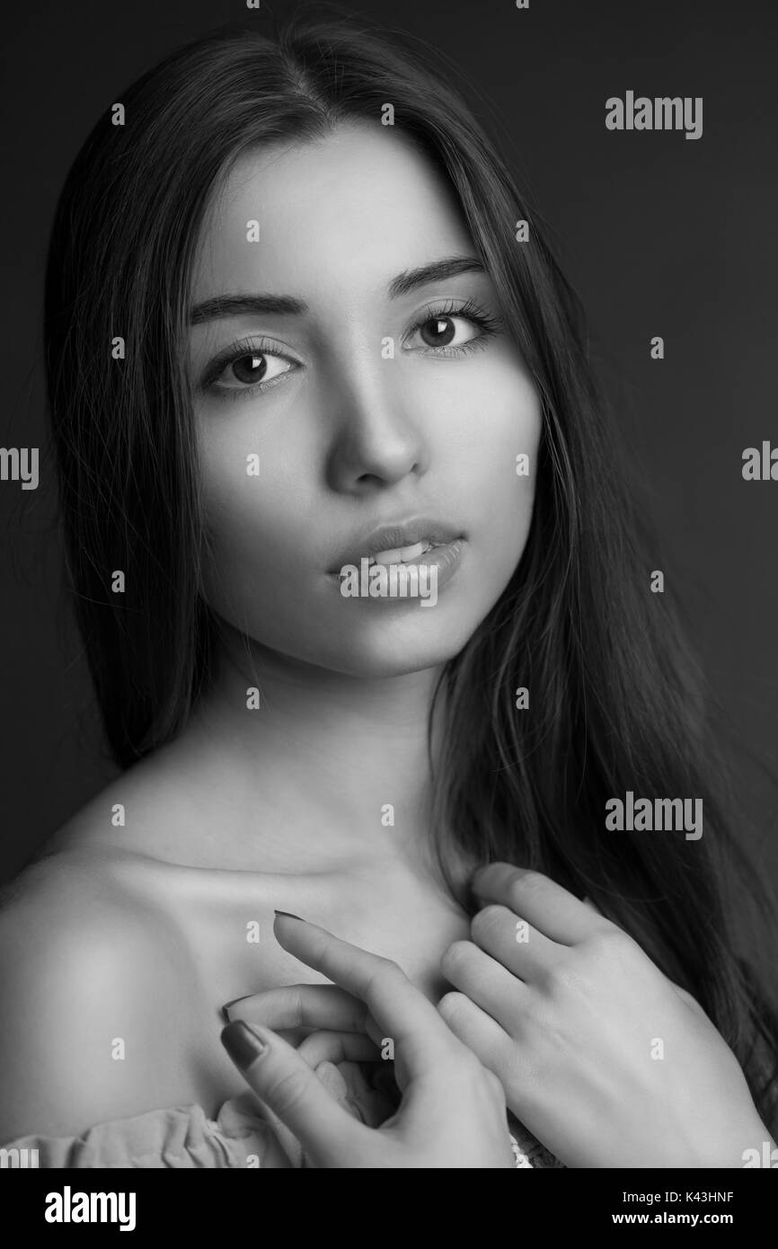 Beauty portrait of a young beautiful brunette woman with long straight ...