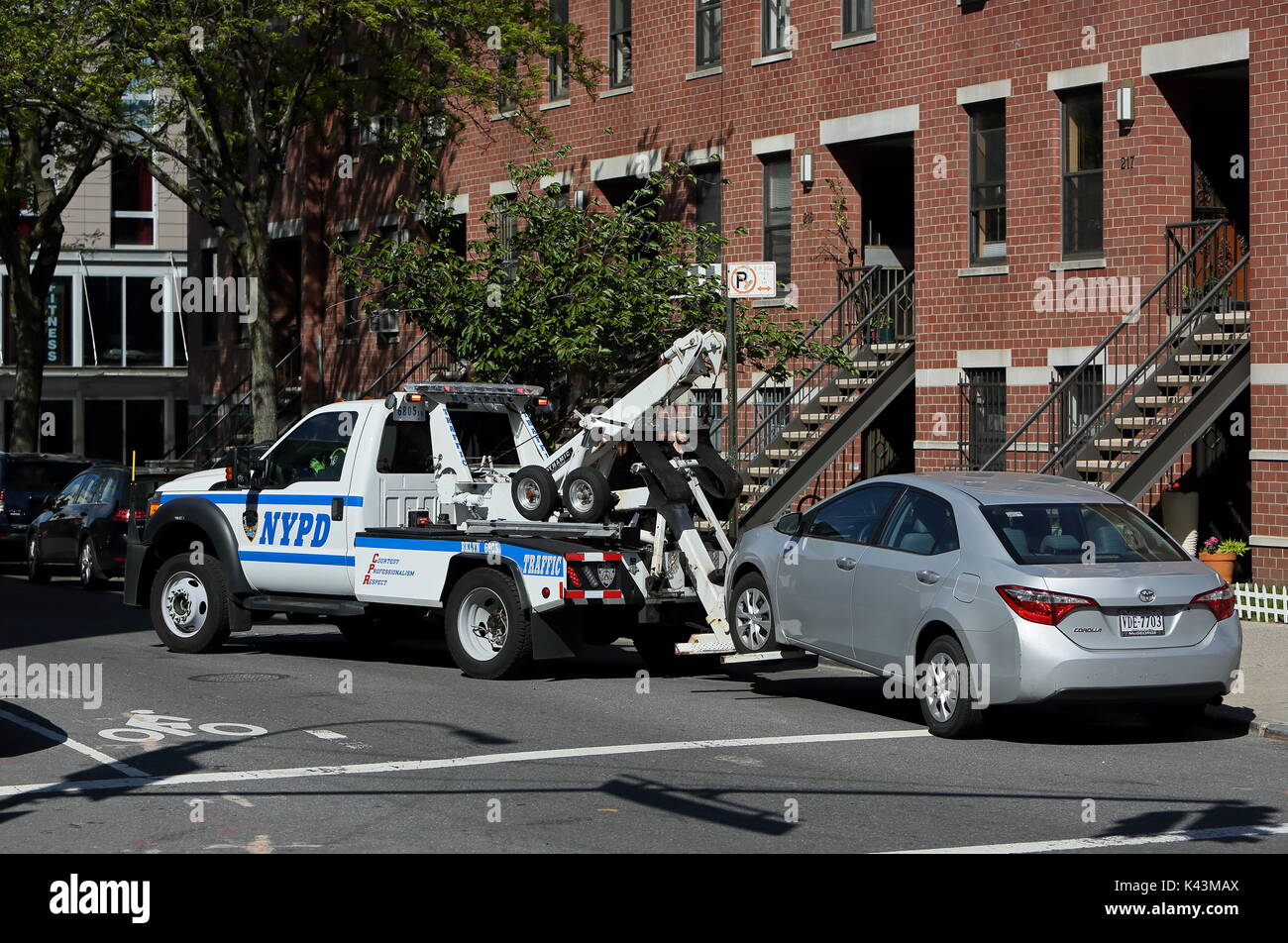 A car is towed in Williamsburg, Brooklyn, New York on May 15, 2017