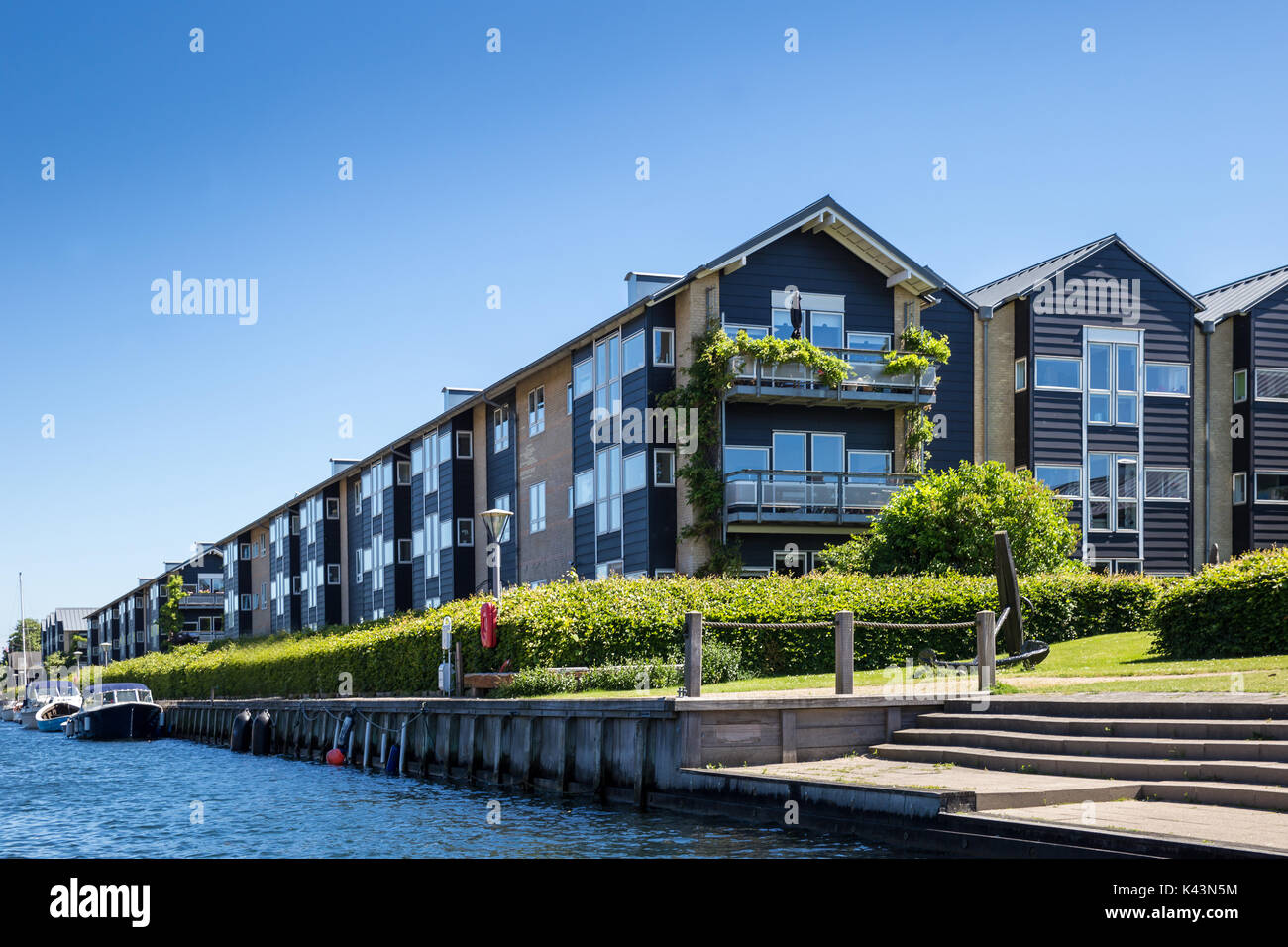 Blue Row Houses along Canal in Copenhagen, Denmark, Europe Stock Photo