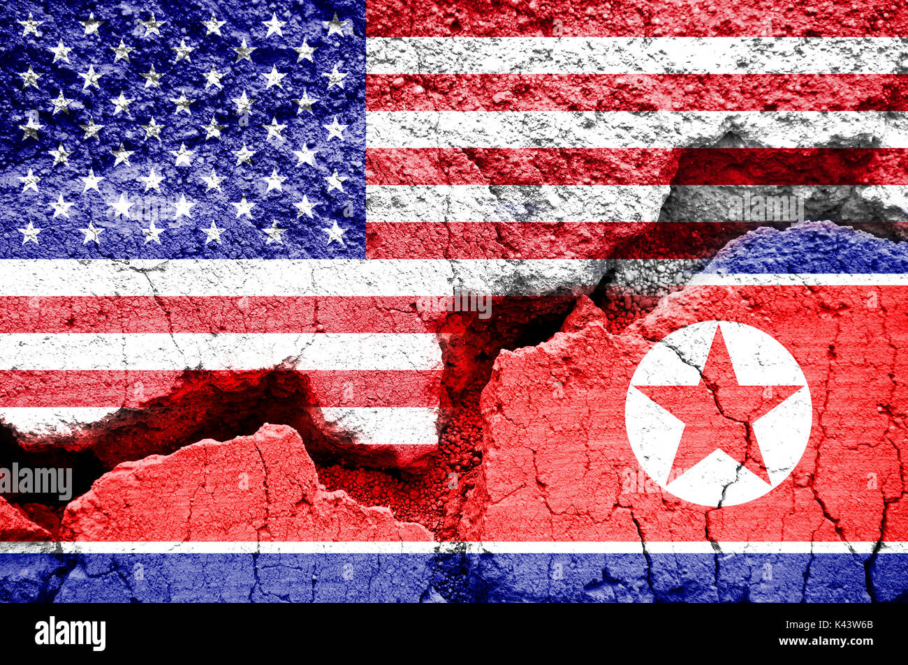 Flag of USA and North Korea on a cracked background. Concept of conflict between two nations, Washington and Pyongyang. Stock Photo