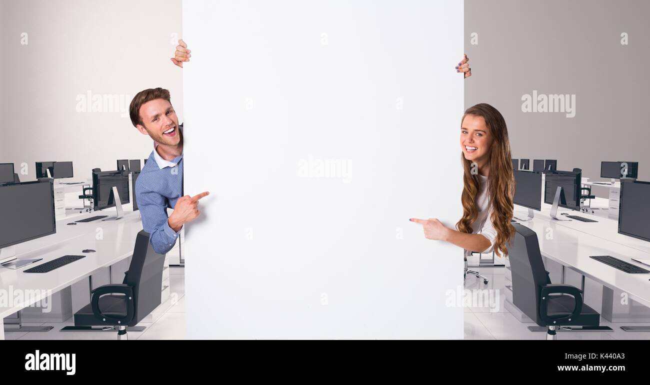 Digital composite of Business people holding blank card in office Stock Photo