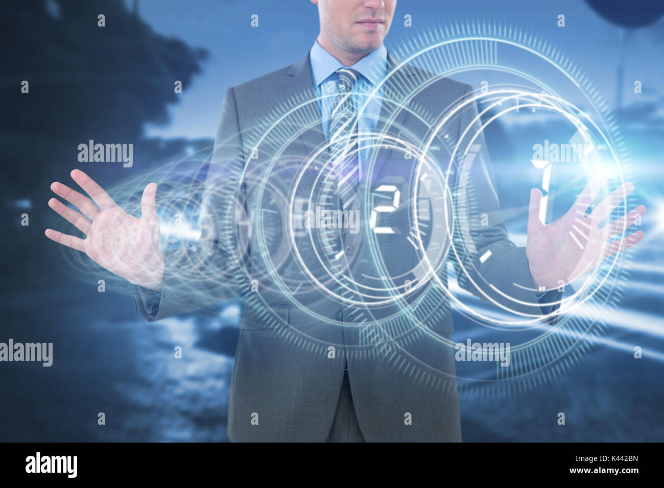 Businessman using futuristic digital screen against interface dial ...