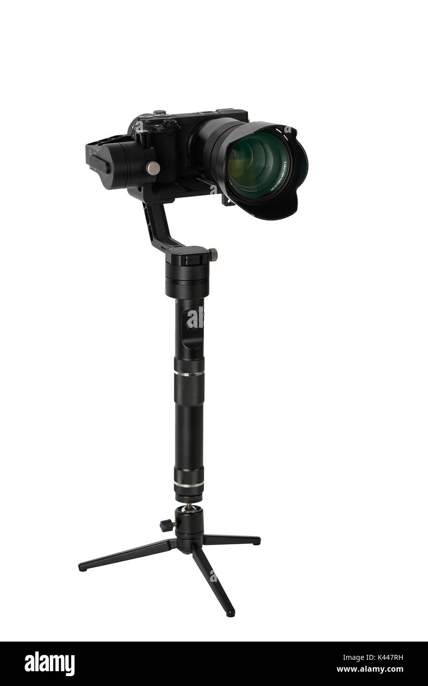 3-axis gimbals Stabilization System with Mirrorless Camera. Using this equipment, a Videographer can take video without shaking. Stock Photo