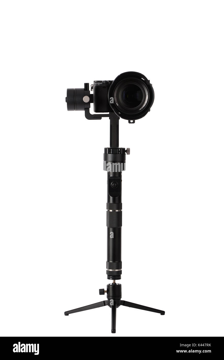 3-axis gimbals Stabilization System with Mirrorless Camera. Using this equipment, a Videographer can take video without shaking. Stock Photo