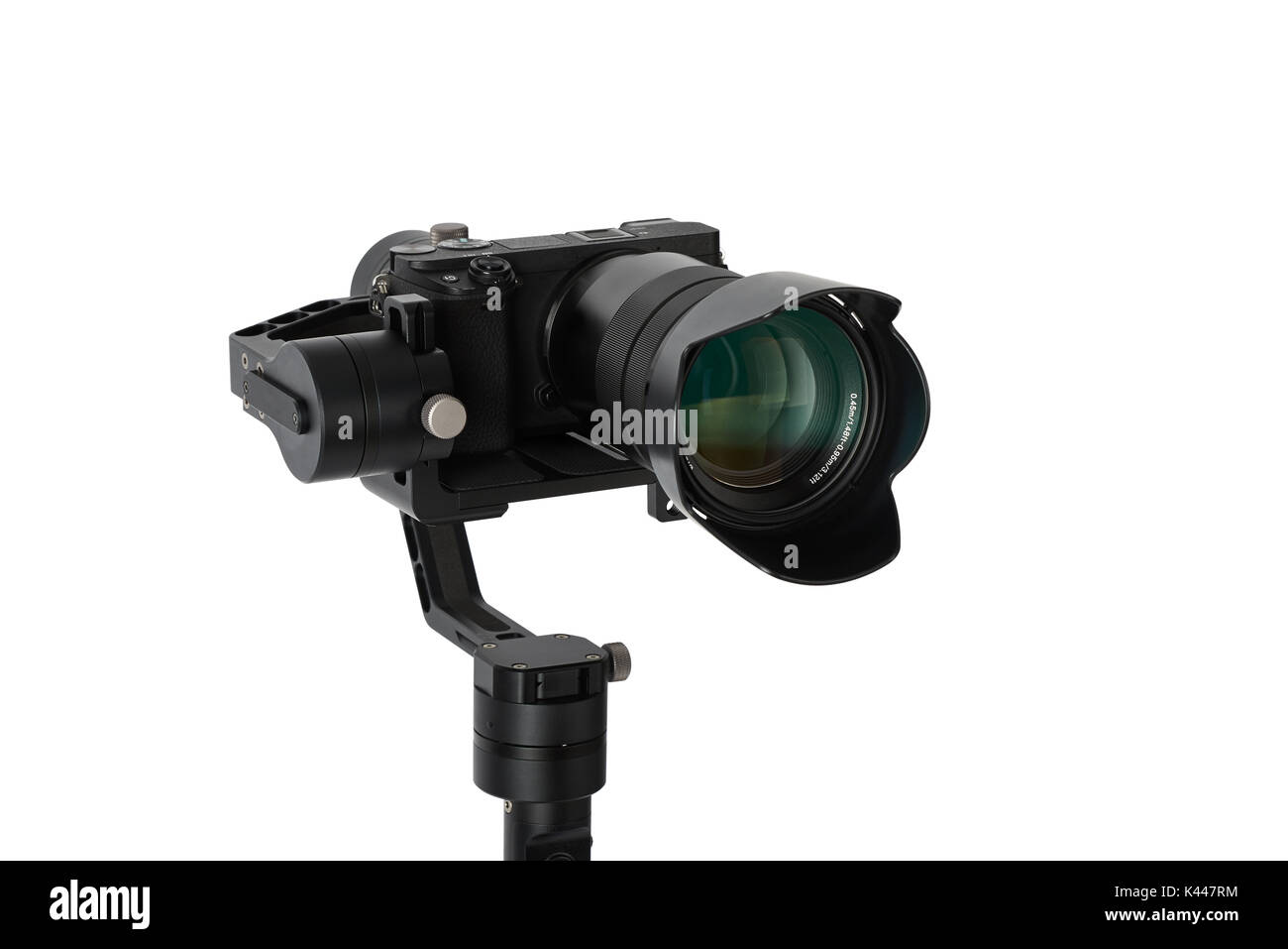 3-axis gimbals Stabilization System with Mirrorless Camera. Using this equipment, a Videographer can take video without shaking. Stock Photo