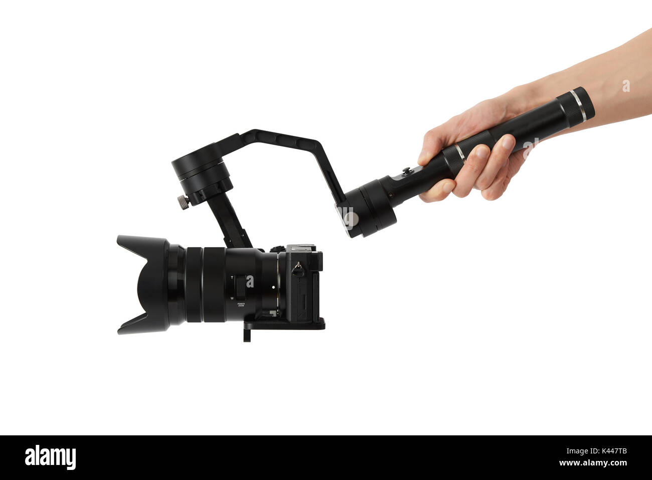 3-axis gimbals Stabilization System with Mirrorless Camera. Using this equipment, a Videographer can take video without shaking. Stock Photo