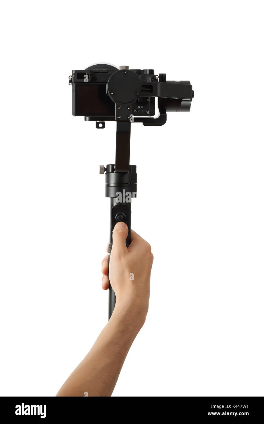 3-axis gimbals Stabilization System with Mirrorless Camera. Using this equipment, a Videographer can take video without shaking. Stock Photo