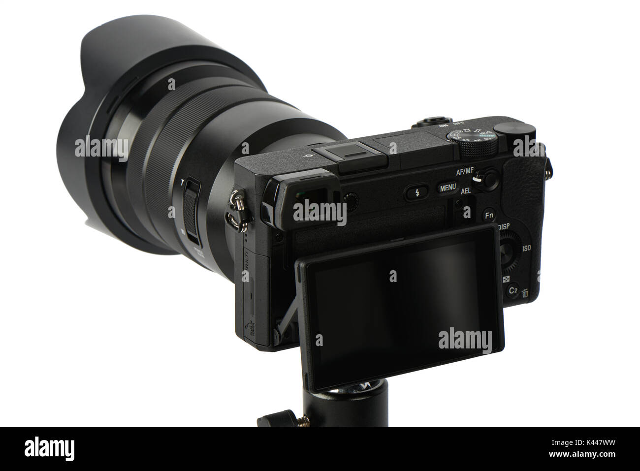 Closeup of mirrorless interchangeable lens camera with zoom lens and