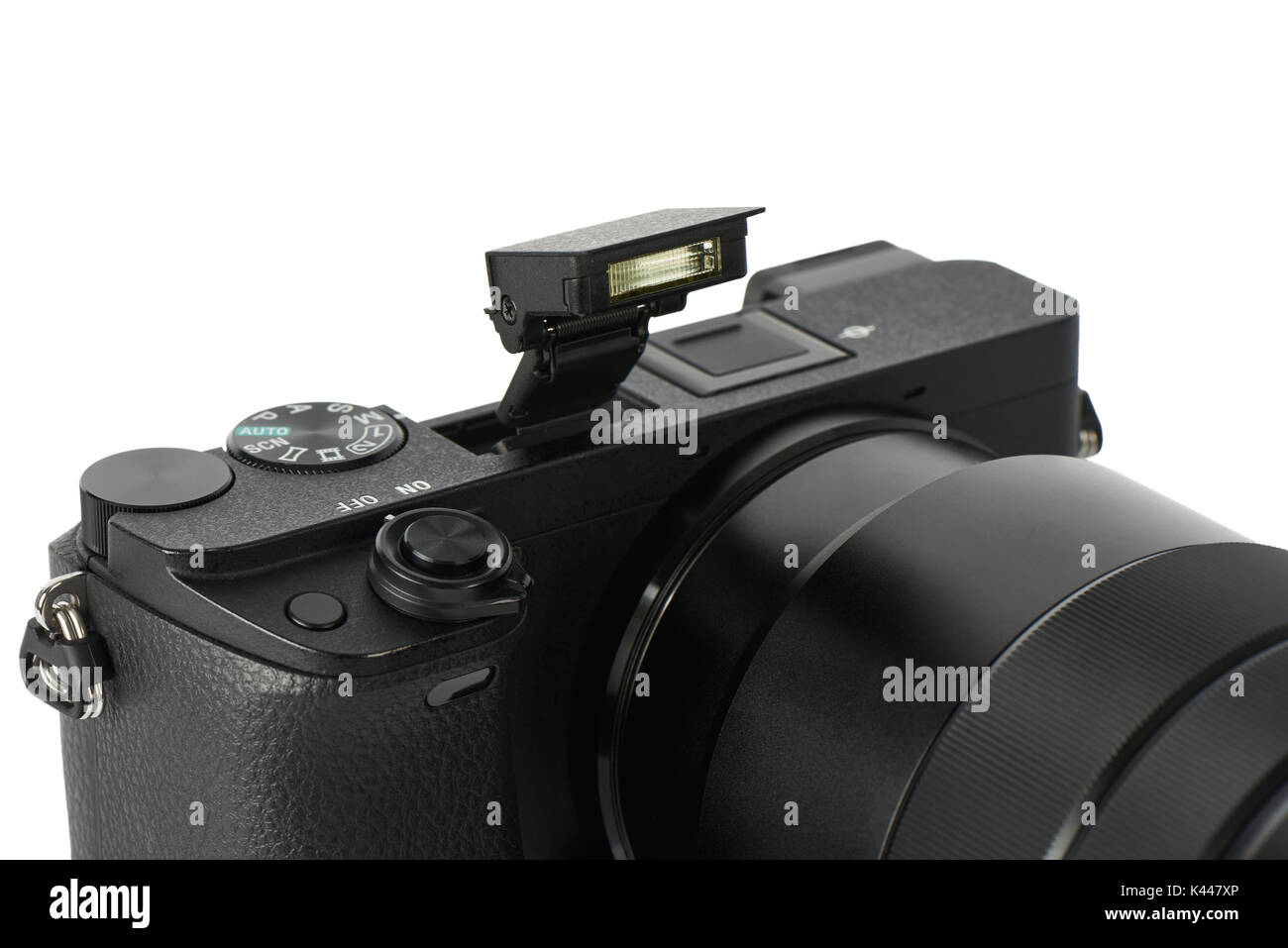 Closeup of pop-up flash on a mirrorless interchangeable lens camera with zoom lens Stock Photo