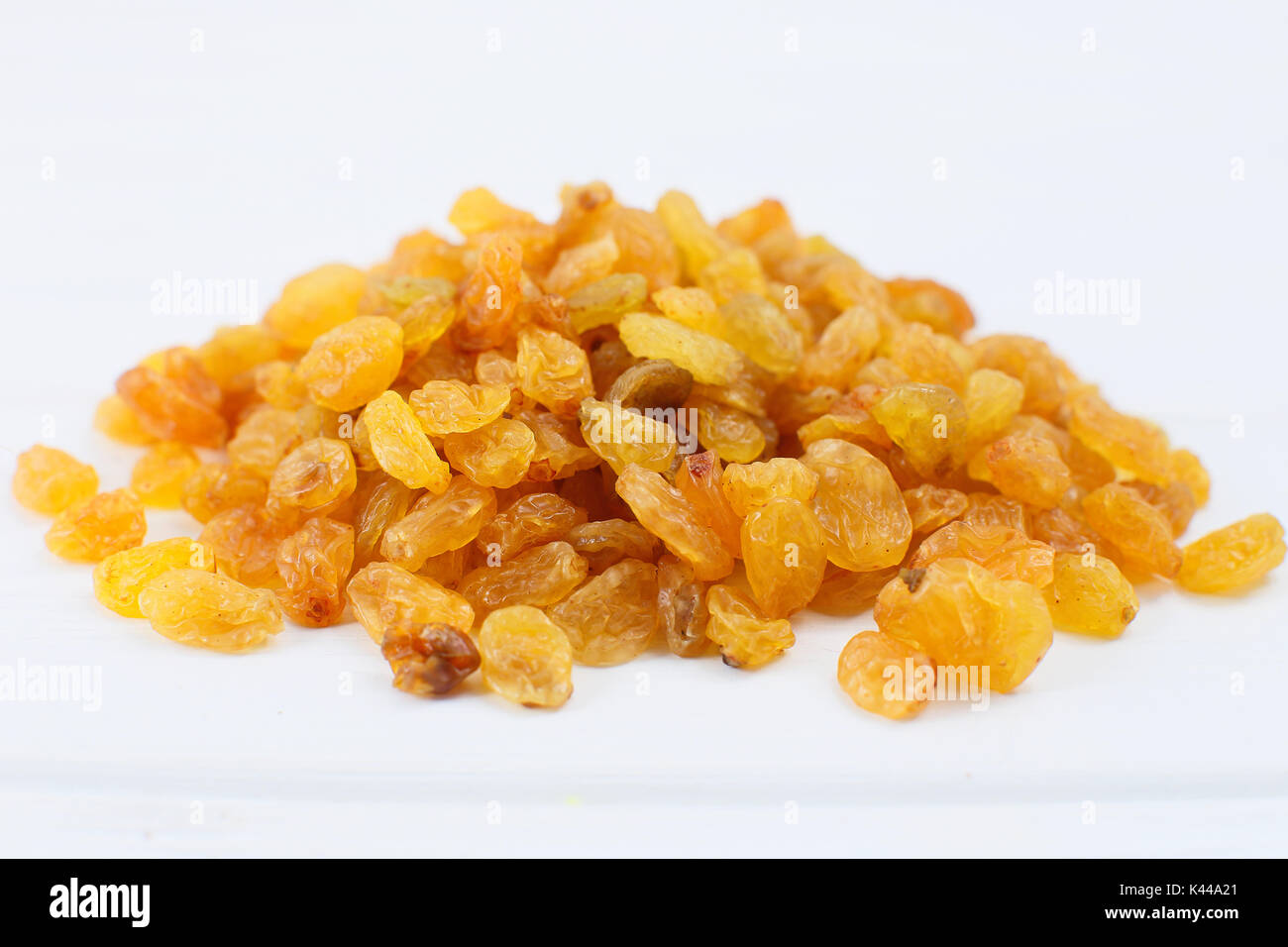 Yellow sultanas raisins isolated on white background cutout. Stock Photo