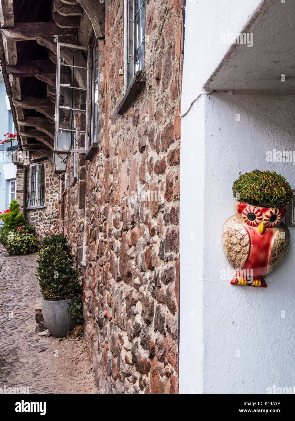Quirky plant holder on a house wall in Dunster near Minehead, Somerset. Stock Photo