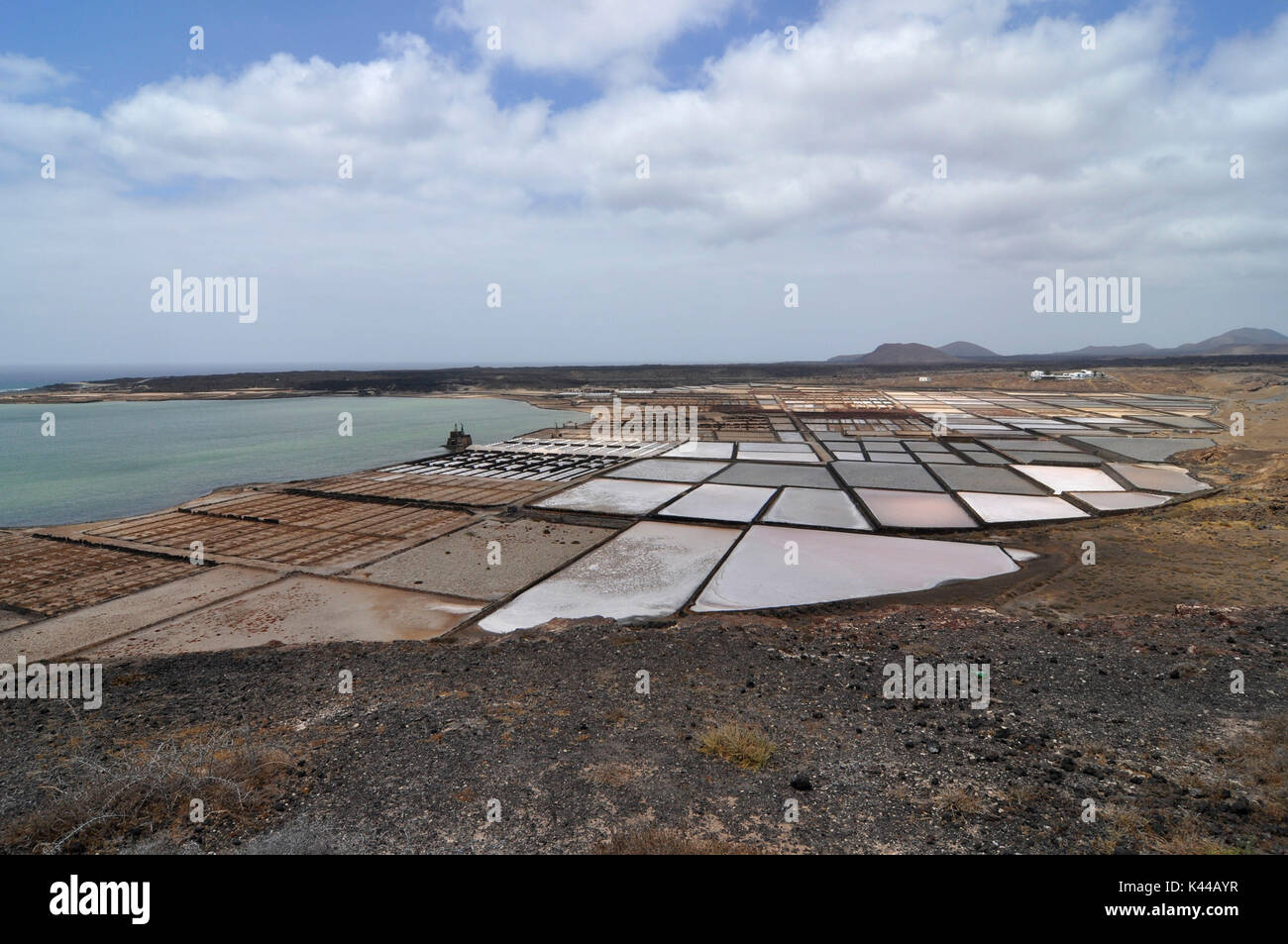 The salt marshes of Janubio in Lanzarote are the largest of the Canary Islands.  They are a traditional source of work activity for man and of supply of drinking water. Stock Photo