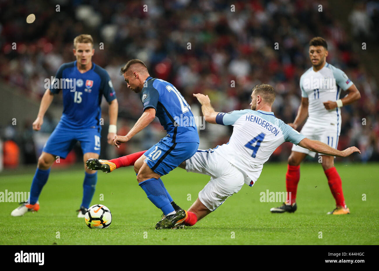 Jordan Henderson of England tackles Robert Mak of Slovakia from Stock Photo  - Alamy