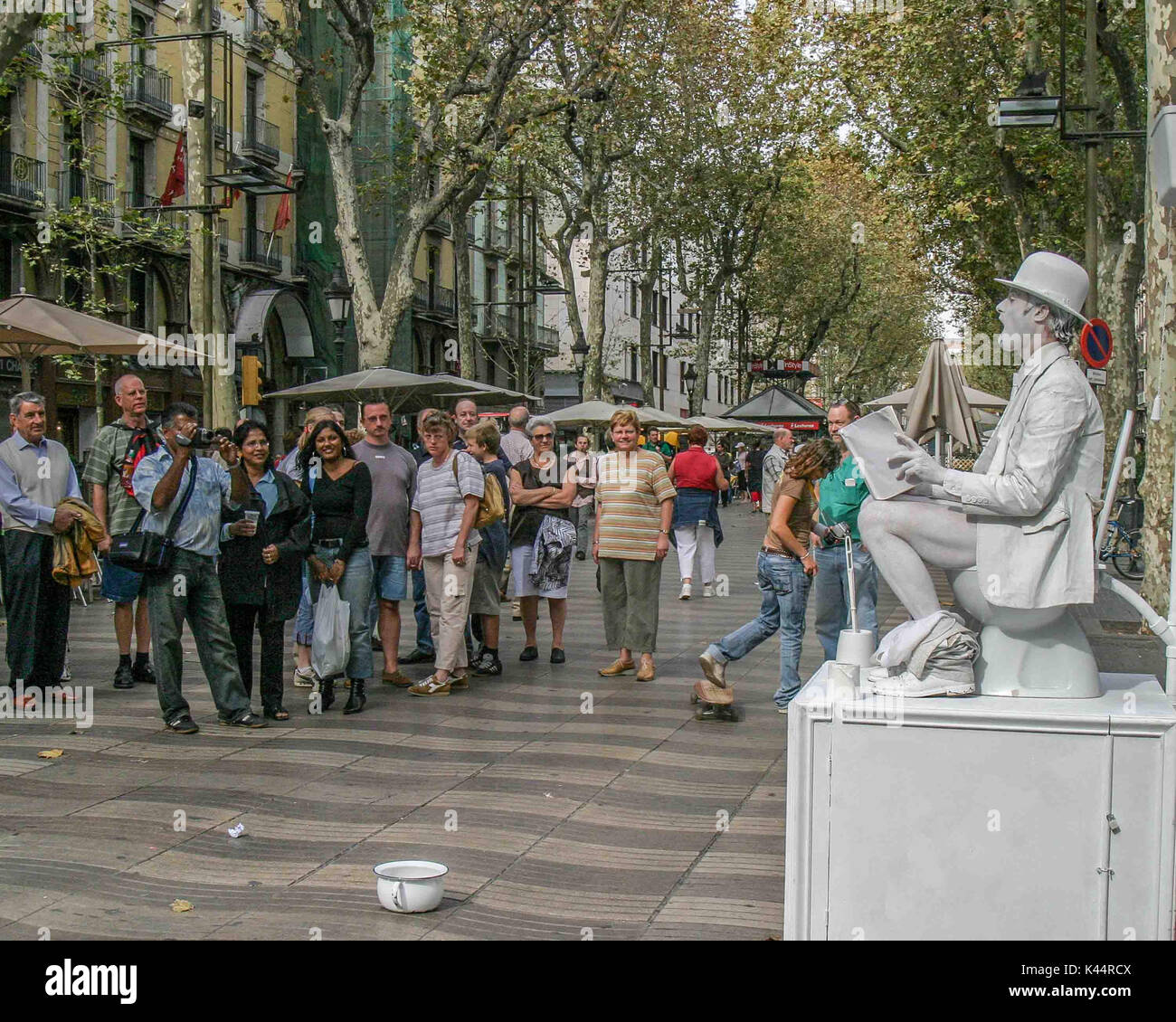 Barcelona, Spain. 19th Oct, 2004. Las Ramblas street performers have entertained for Barcelona tourists and locals alike and are part of the scene of the famed tree lined pedestrian mall. A major tourist destination, Barcelona has a rich cultural heritage. Credit: Arnold Drapkin/ZUMA Wire/Alamy Live News Stock Photo