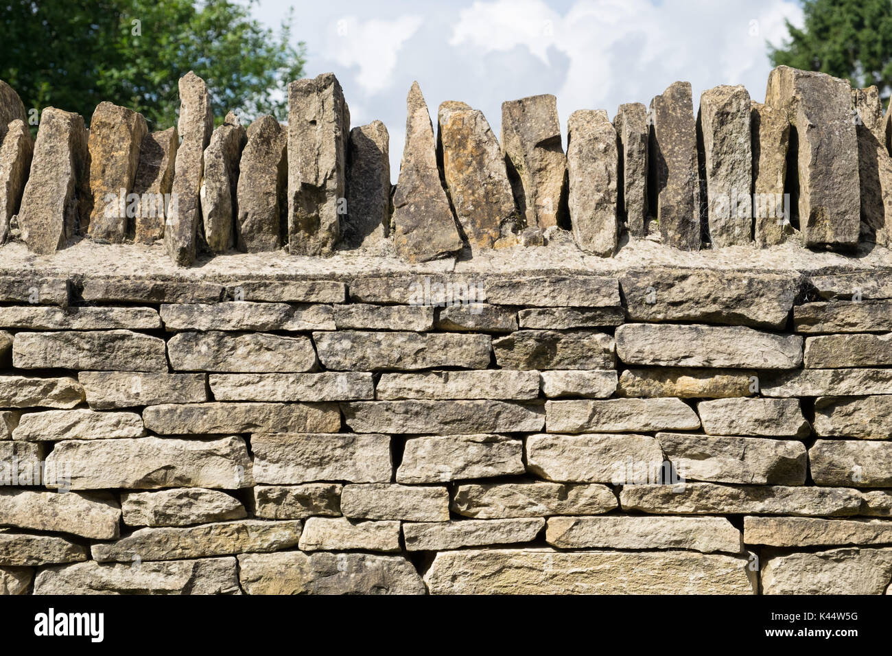 A modern Cotswold dry stone wall Stock Photo