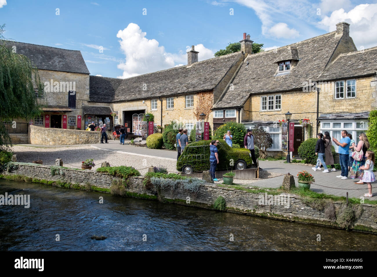 The Cotswold motoring museum on a sunny day in Bourton on the Water, Gloucetershire, UK. Viewed from across the river Windrush Stock Photo