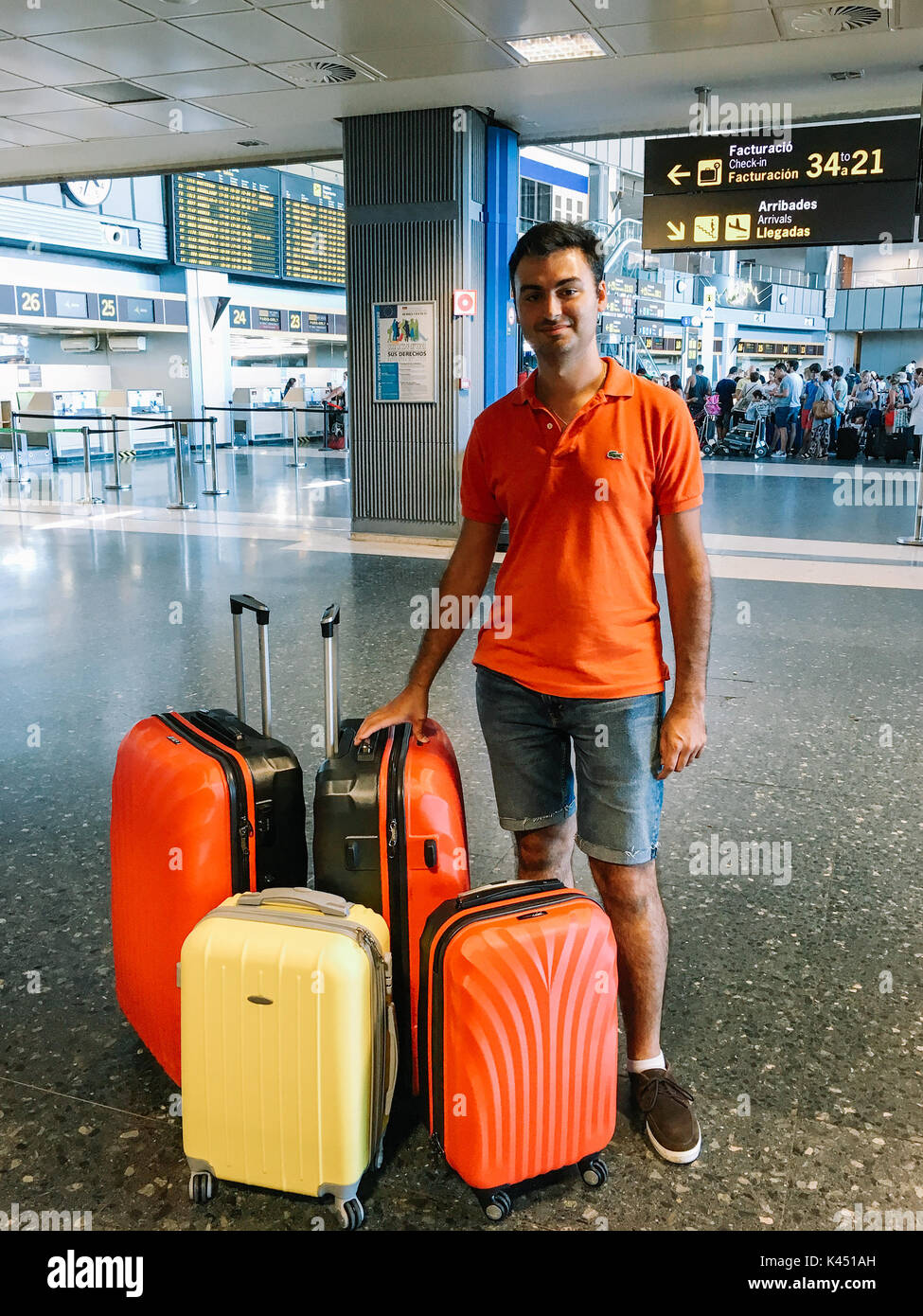 VALENCIA, SPAIN - AUGUST 06, 2016: Man With Many Luggage Bags Is Waiting For Airplane In Airport Terminal. Stock Photo