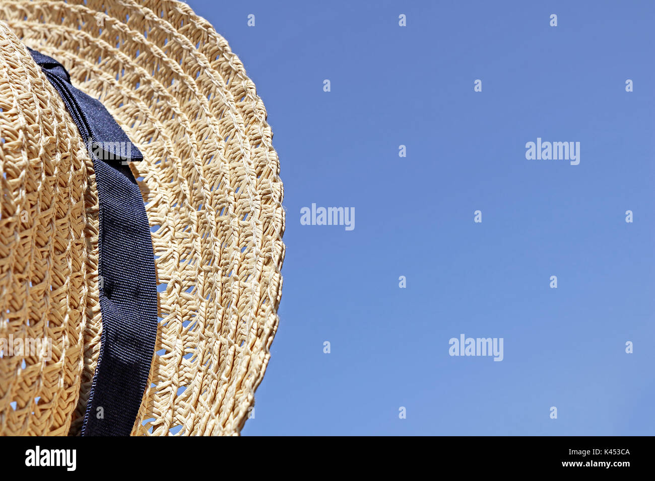 Straw hat on the sky background Stock Photo - Alamy