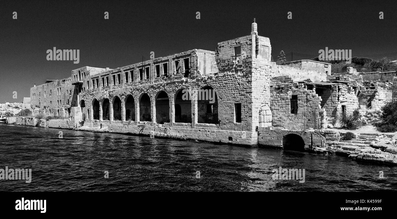 Black and white photograph of Buildings used by Royal Navy Tenth Submarine Flotilla during Second World War - Manoel Island, Marsamxett Harbour, Malta Stock Photo