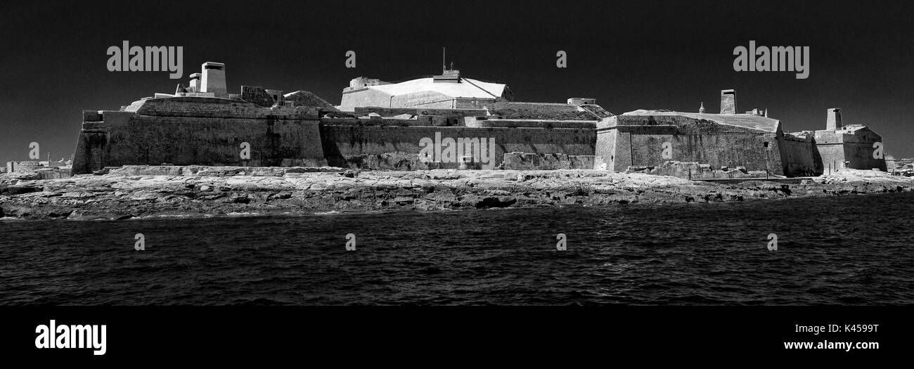 Black and white photograph of Fort St Elmo, Valletta, Malta, from entrance to Grand Harbour Stock Photo