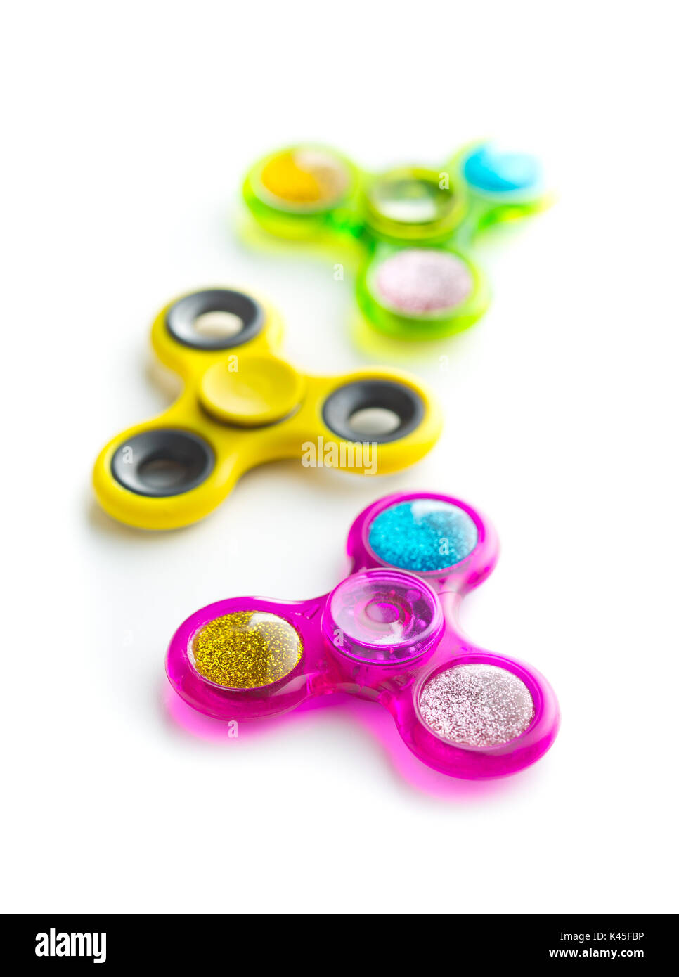 Fidget finger spinners stress isolated on white background. Stock Photo