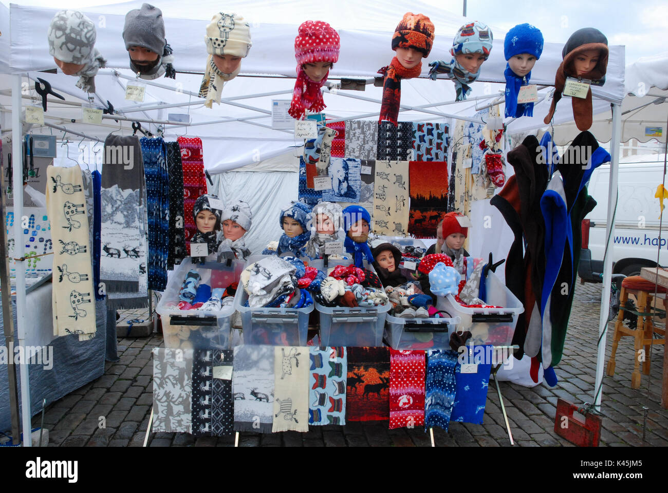 Open-air market stall selling warm hats and scarves in Helsinki, the capital city of Finland Stock Photo