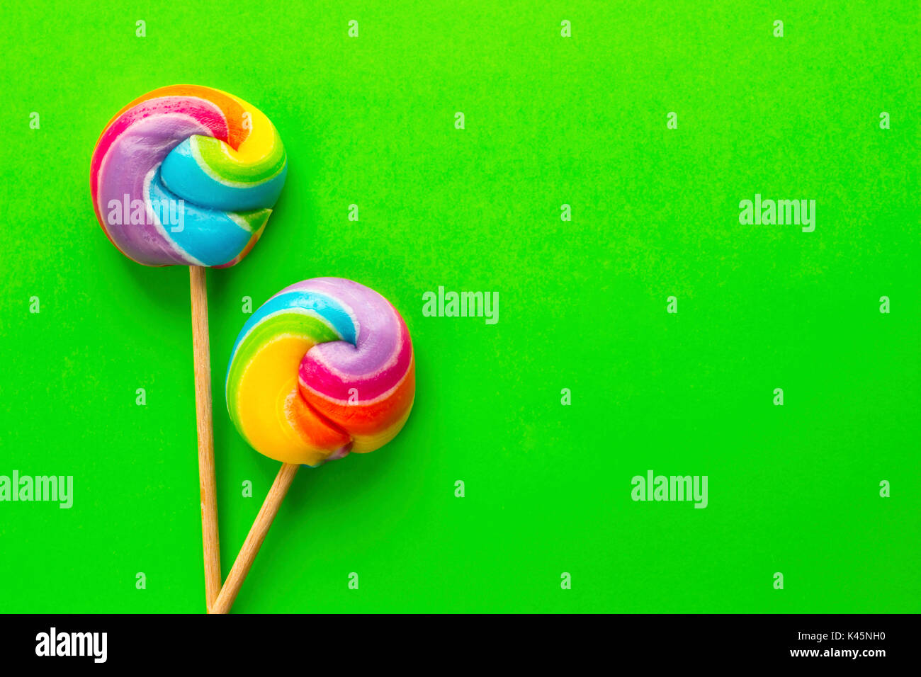 rainbow lollipop on color background Stock Photo