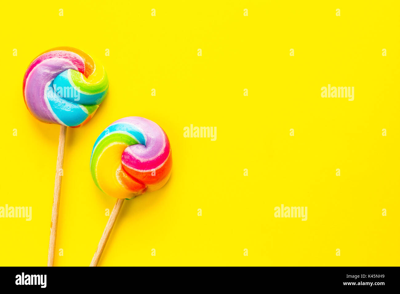 rainbow lollipop on color background Stock Photo