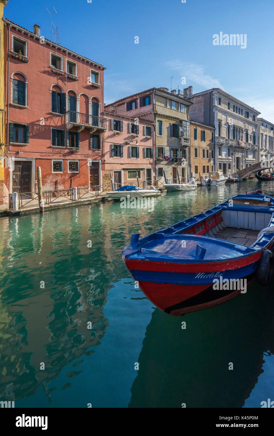 Venice, Veneto, Italy. Boat and buildings with canal Stock Photo