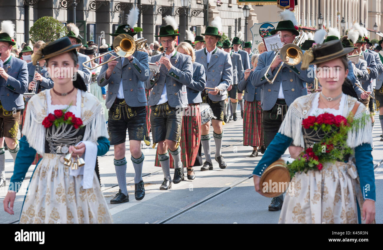 The Oktoberfest in Munich is the world-biggest beer festival and at the public opening parade 9000 participants take place with music bands and horses Stock Photo