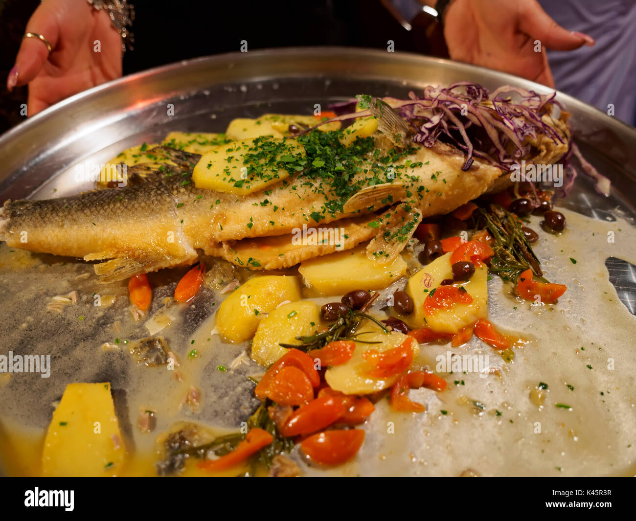 Whole sea bass with vegetables Stock Photo