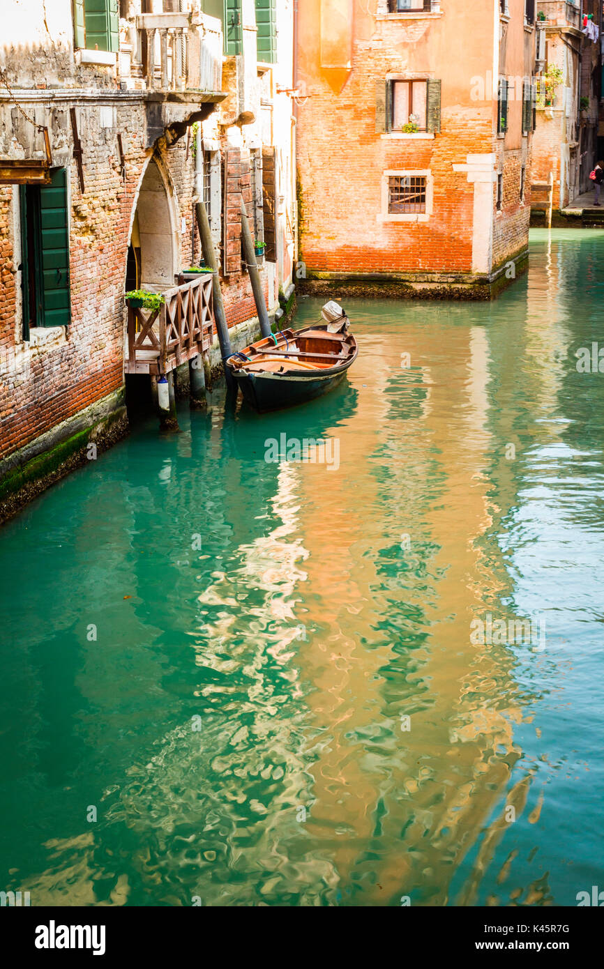 Venice, Veneto, Italy. Boat moored in small canal. Stock Photo
