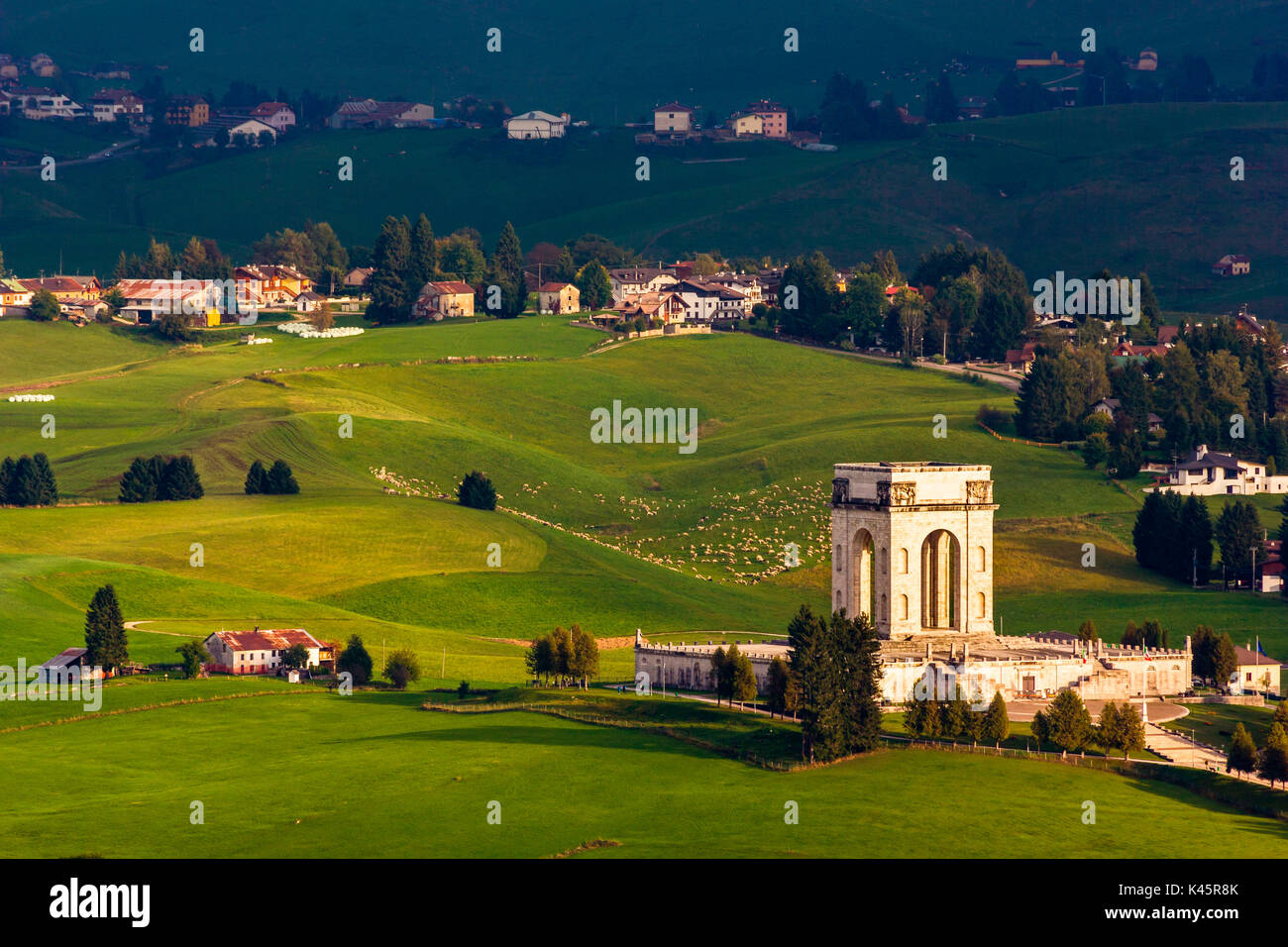 Transhumance, Altopiano of Asiago, Province of Vicenza, Veneto, Italy. Annual movement of sheep around military monument. Stock Photo