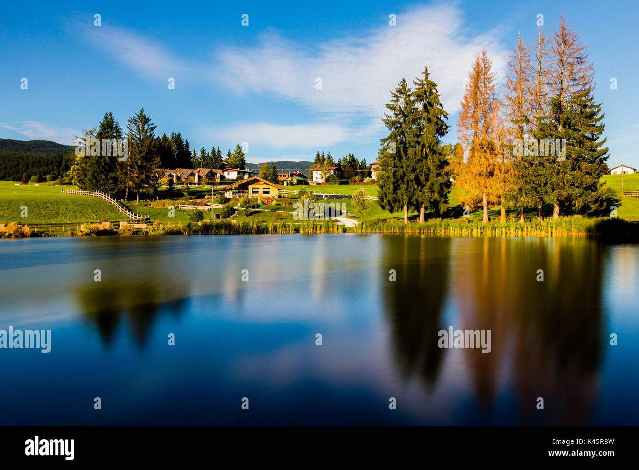 Lake, Lumera, Altopiano of Asiago, Province of Vicenza, Veneto, Italy. Reflections in autumn. Stock Photo