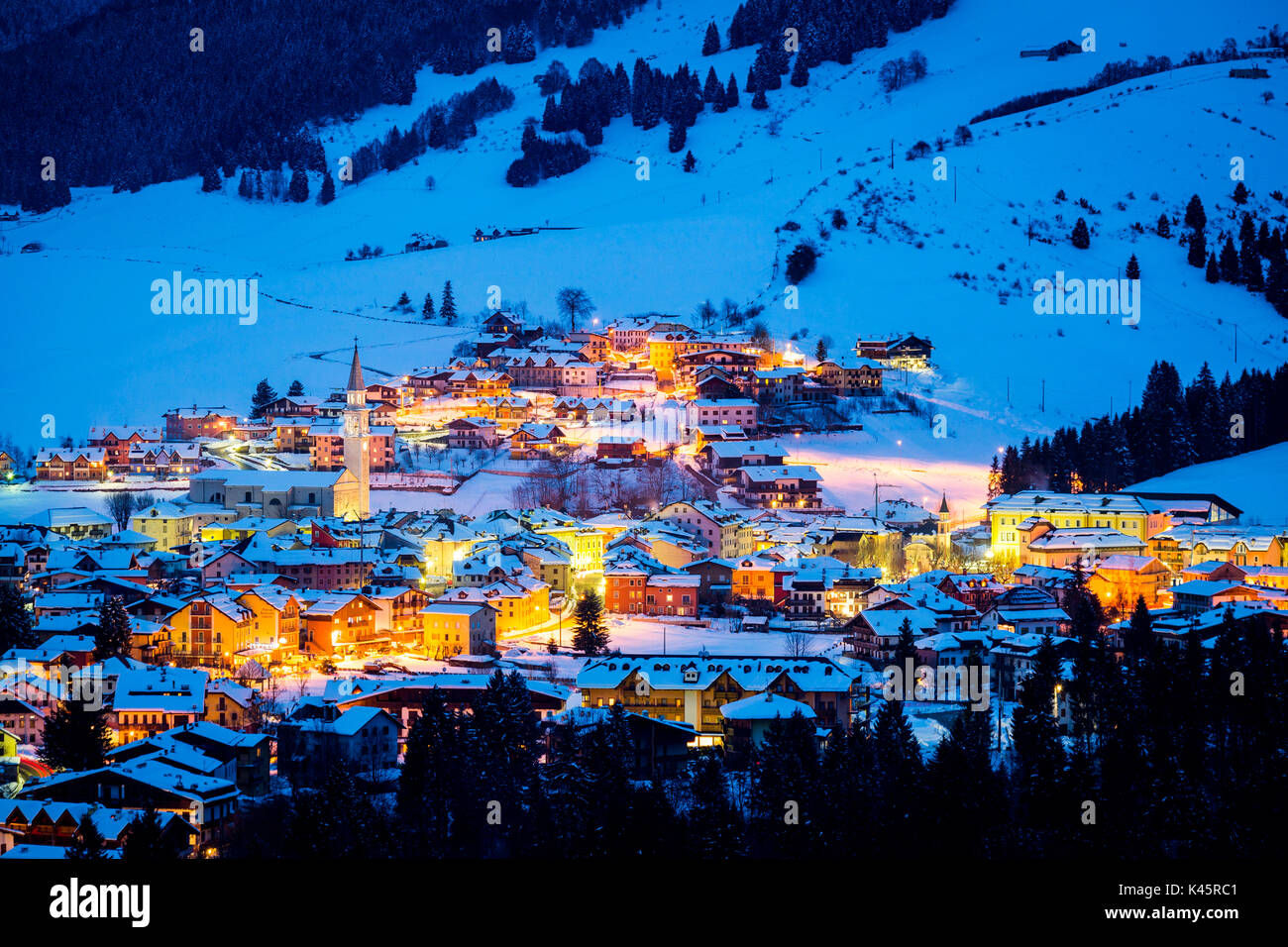 Town, Gallio, Altopiano of Asiago, Province of Vicenza, Veneto, Italy. Mountain ski resort during blue hour. Stock Photo