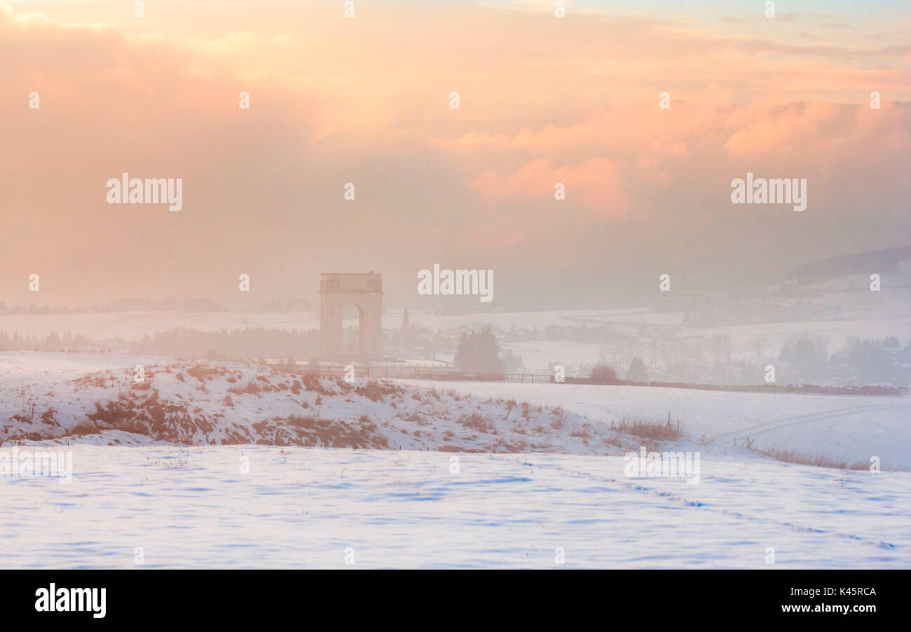 Altopiano of Asiago, Province of Vicenza, Veneto, Italy. War memorial monument in misty winter landscape. Stock Photo