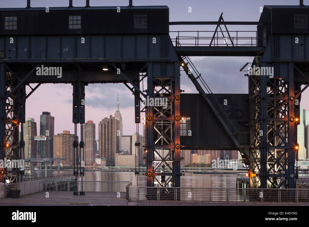 USA, New York, New York City, Long Island City, Mid town Manhattan skyline from Gantry Plaza State Park, dawn Stock Photo