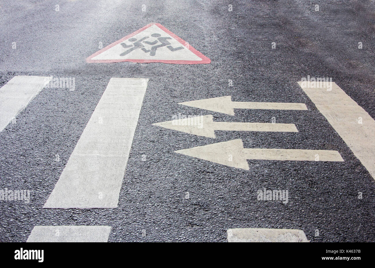 pedestrian crossing and School warning road sign painted on roadway Stock Photo