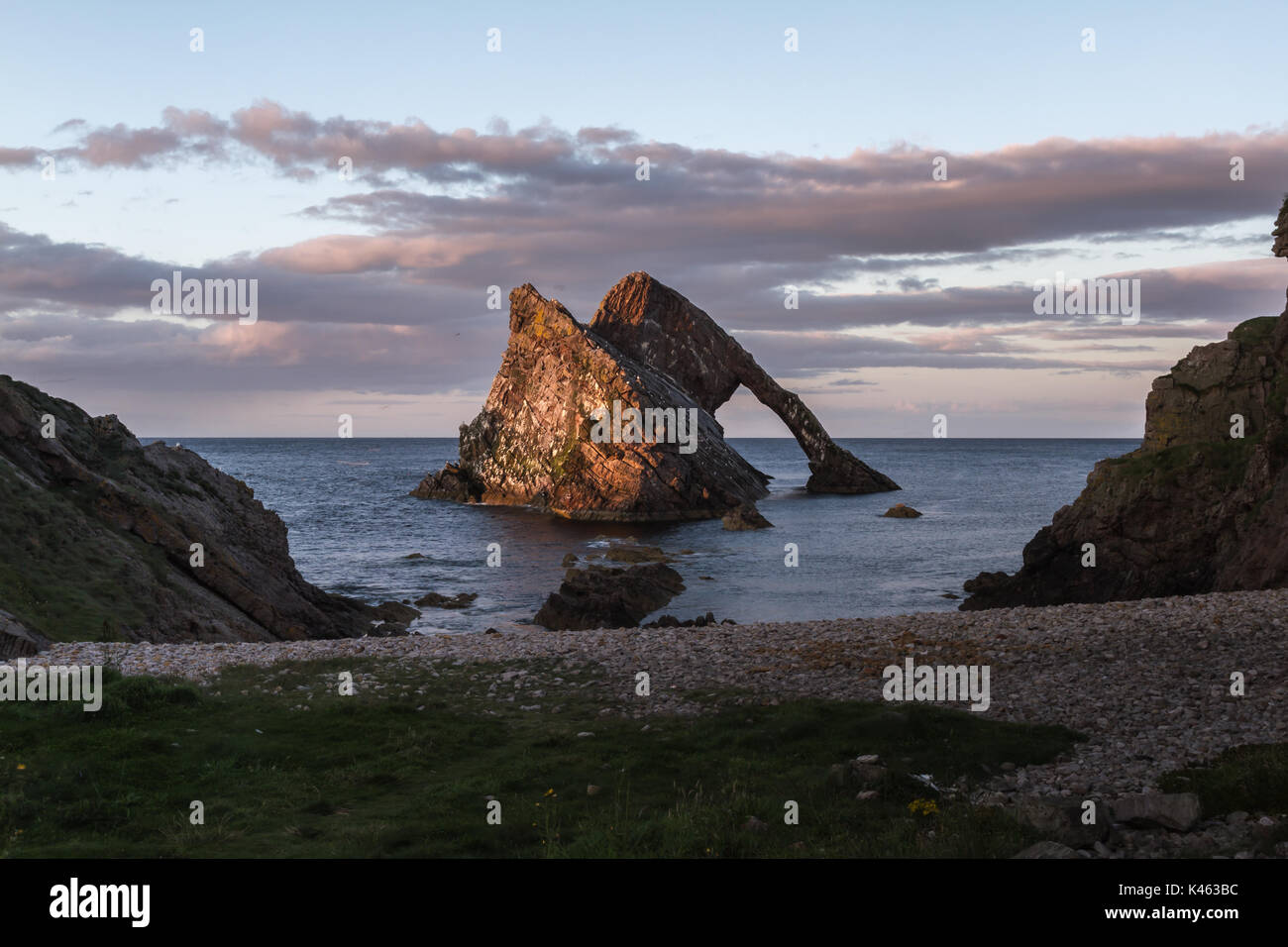 Bow Fiddle Rock sea arch at Portknockie, Scotland, UK at sunset Stock Photo