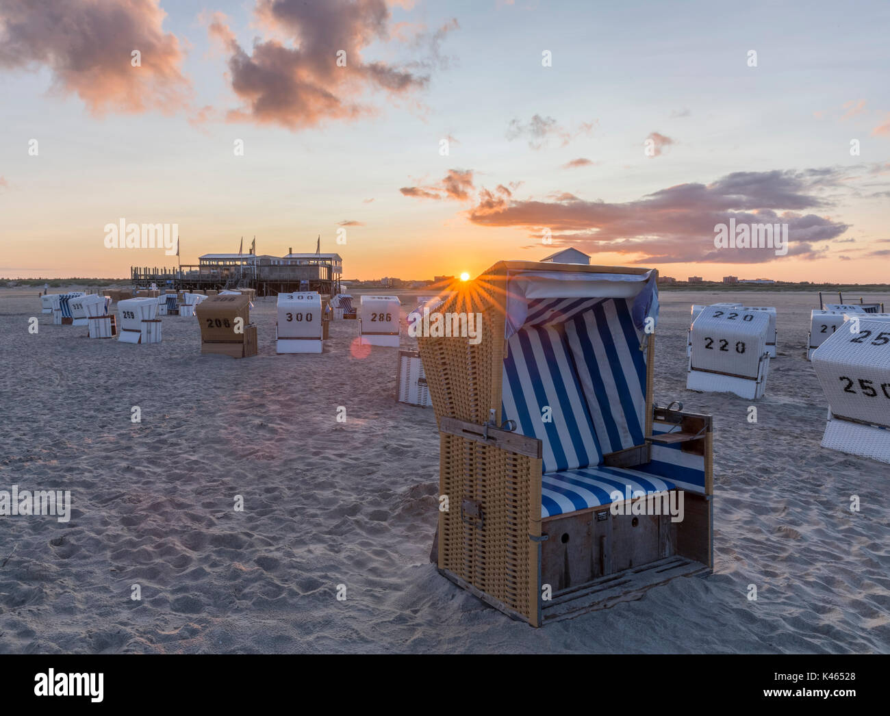 Traditional beach baskets or hooded beach chairs at nothern Germany Stock Photo