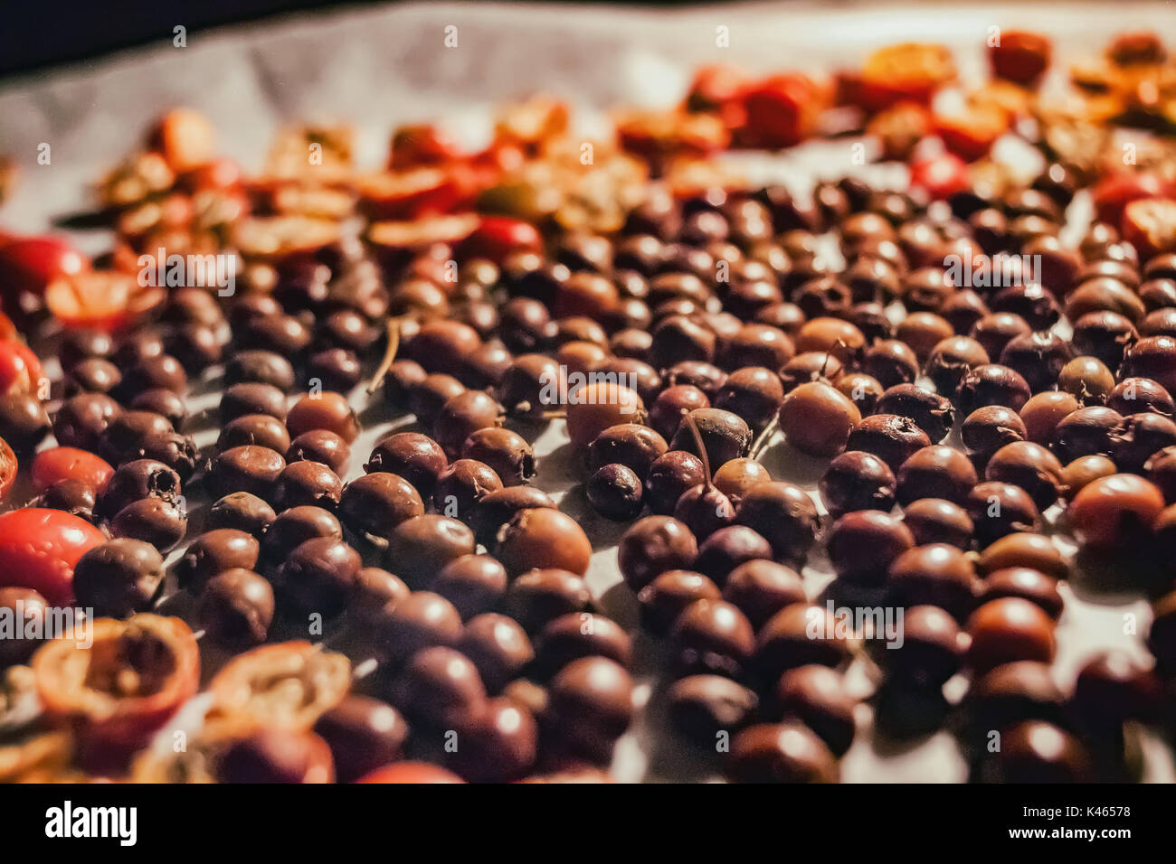 Rose hip and buck thorn drying in oven Stock Photo Alamy