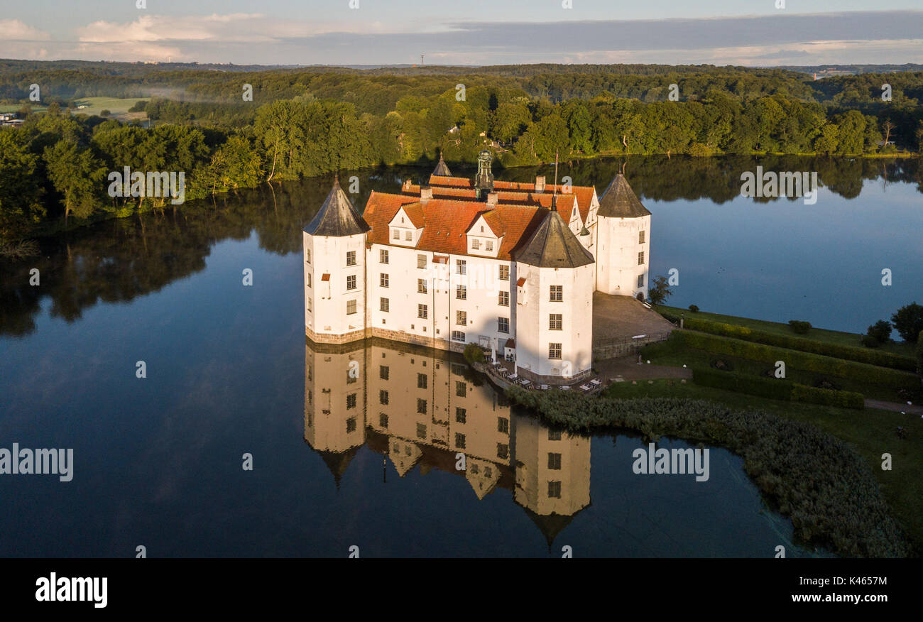 Aerial view of Glucksburg water castle at dawn, Germany Stock Photo